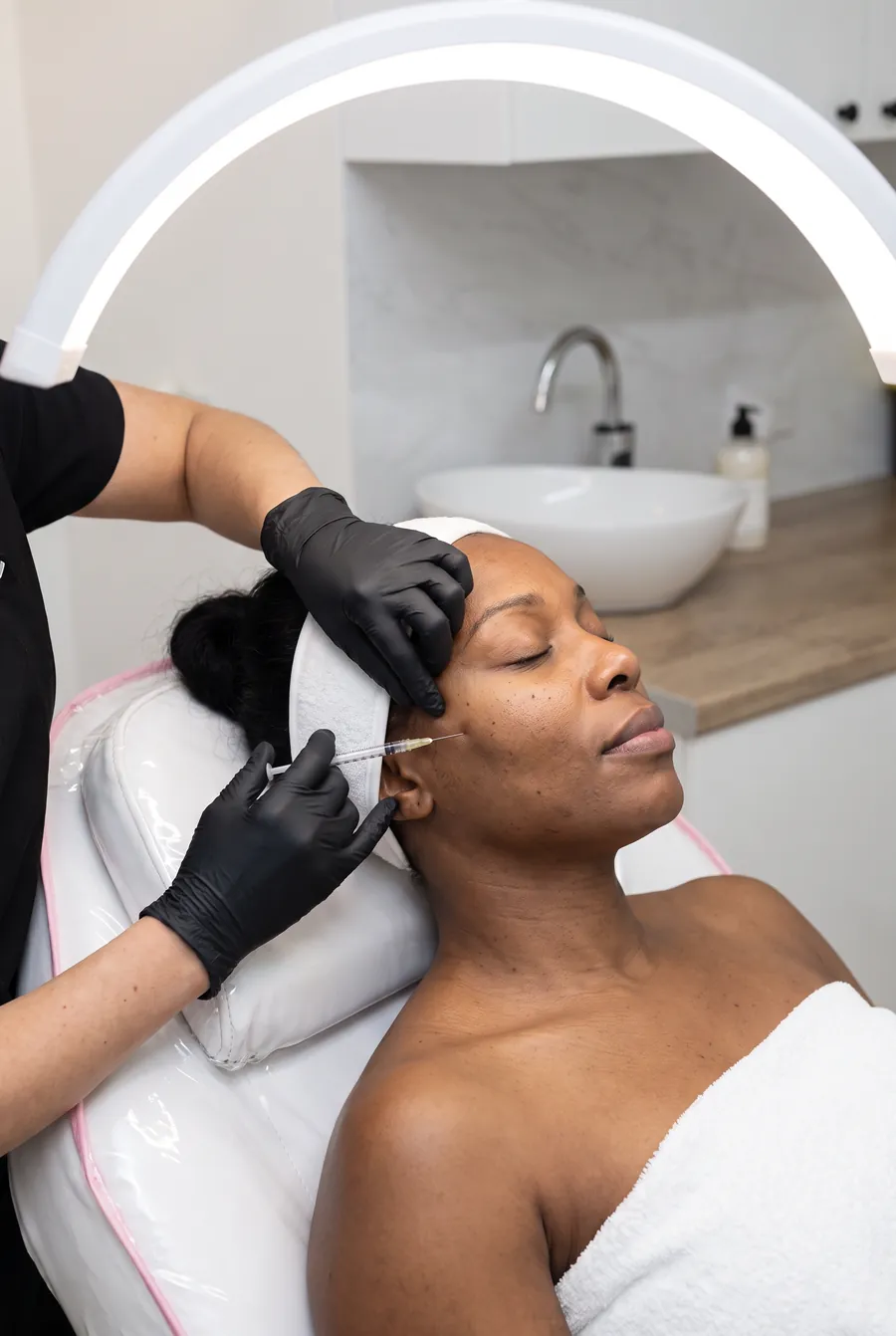 A Lumi-Pro skin booster treatment being performed